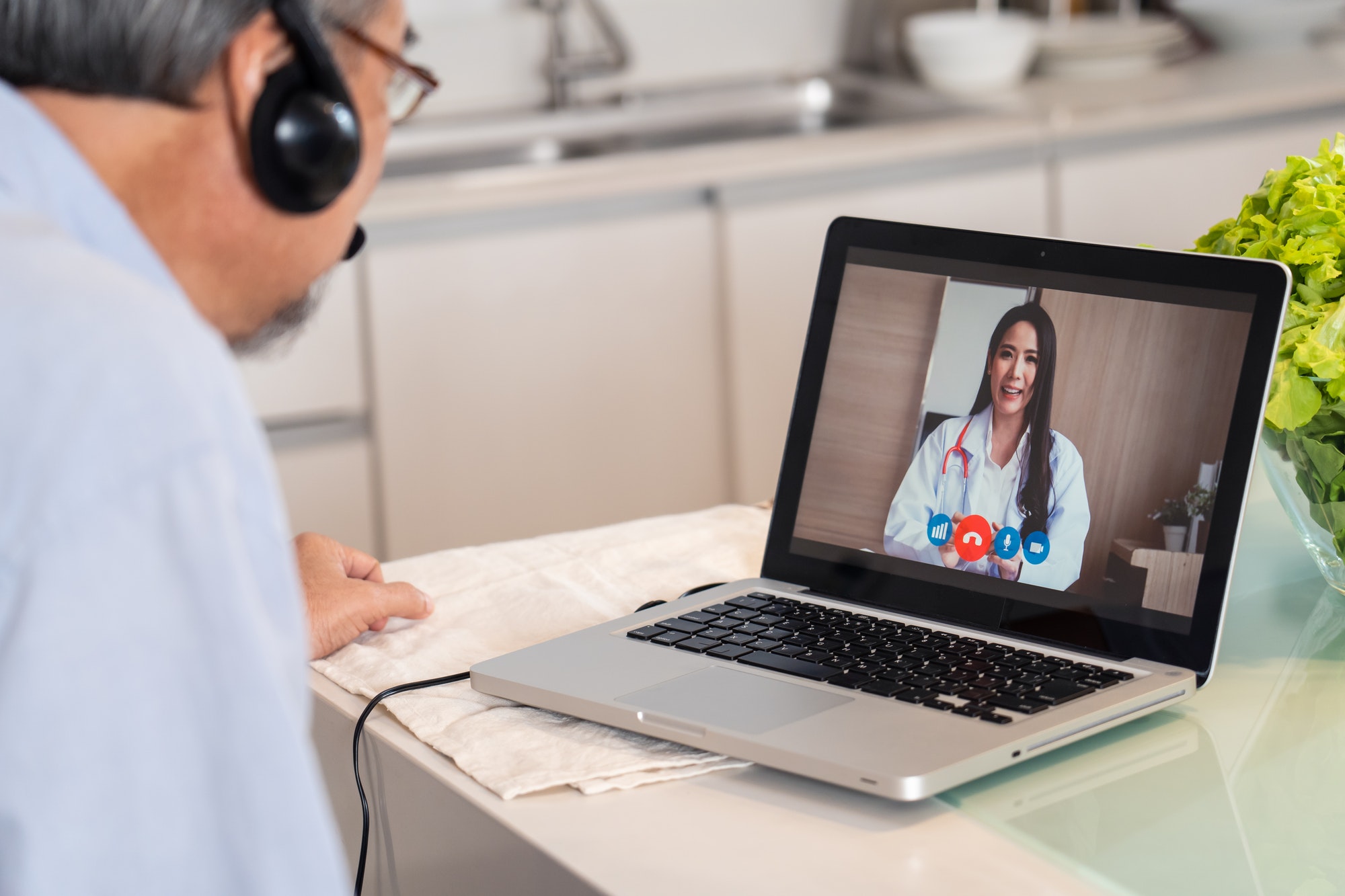 asian-senior-elderly-man-grandfather-video-call-with-doctor-in-living-room-at-home.jpg