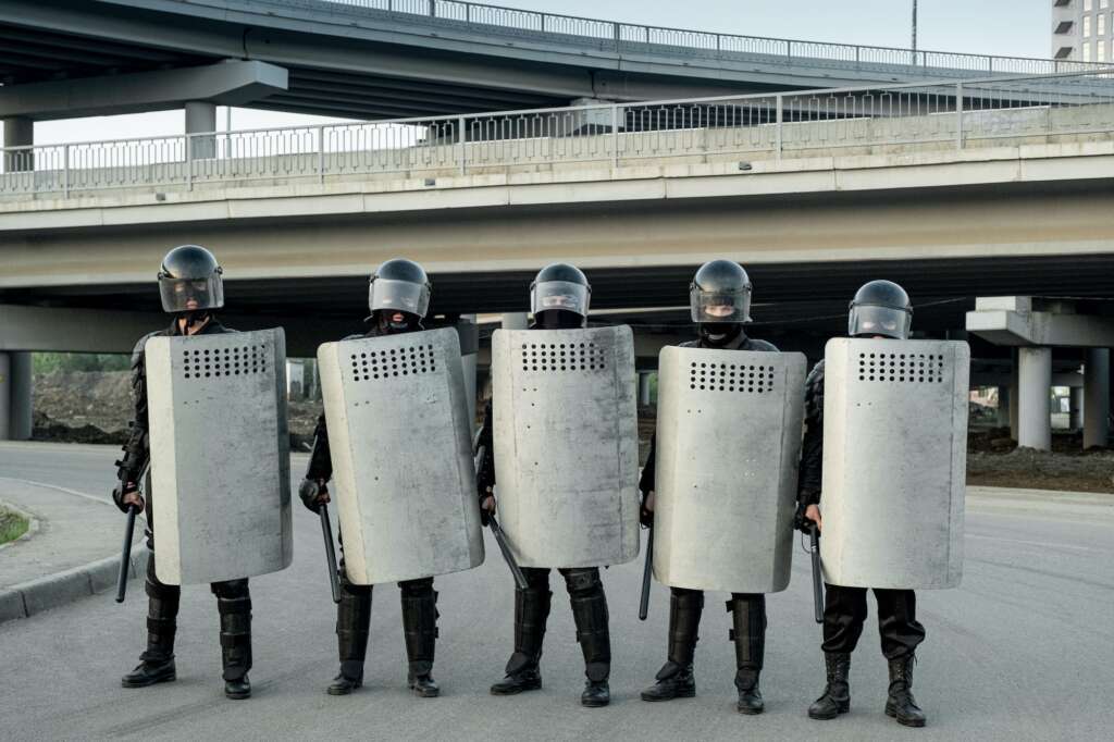 Group of police guards standing in row